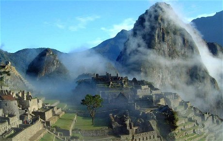 Mist rising above the magical Inca citadel of Machu Picchu