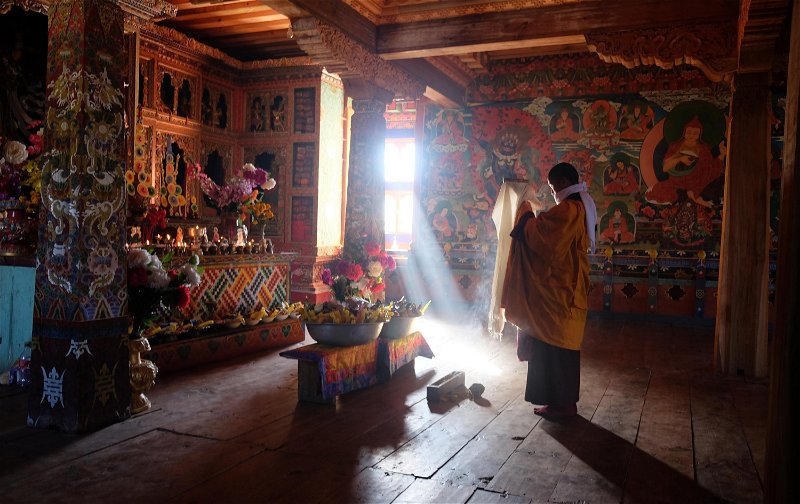 A monk in quiet reflection at one of the many ornately decorated monasteries along the trek