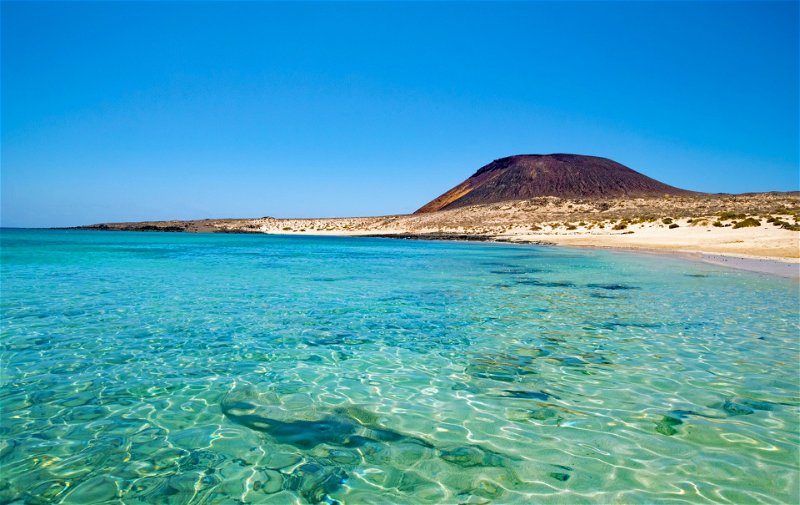 Take a dip in the clear waters of Playa Francesca on La Graciosa